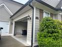 Attached two car garage with a white door and access to the main house at 312 Archway Ln, Peachtree City, GA 30269