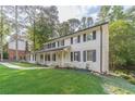 Beautifully landscaped front yard enhances the curb appeal of this well-maintained two-story home at 4367 Cedar Wood Sw Dr, Lilburn, GA 30047