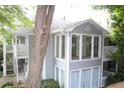 Exterior view of condo featuring large windows, steps and green shrubbery at 1105 Natchez Trce, Atlanta, GA 30350