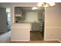 Open kitchen view with stainless steel appliances and modern cabinets at 1105 Natchez Trce, Atlanta, GA 30350