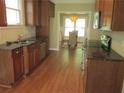 Modern kitchen featuring dark countertops, stainless steel appliances, and hardwood flooring at 1527 Princeton Ave, College Park, GA 30337
