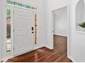 Bright foyer with hardwood floors, leading to other rooms at 604 Bassett Se Ct, Smyrna, GA 30080