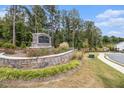 The Park Center Pointe entrance is marked with a stone sign, flowers and shrubbery at 1195 Park Center Cir, Austell, GA 30168