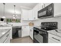A spacious kitchen with modern stainless steel appliances and bright lighting at 286 Blue Pointe Ct, Suwanee, GA 30024