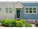 Welcoming front entrance with well-maintained landscaping, and a charming, covered entryway at 3760 Oxford Cir, Doraville, GA 30340