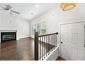 Open-concept living room features hardwood floors, a fireplace, and natural light from large window at 3760 Oxford Cir, Doraville, GA 30340