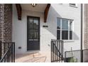 Welcoming entryway with address display, sleek black door, and brick steps leading to the entrance at 1309 Bennett Creek Ovlk, Suwanee, GA 30024