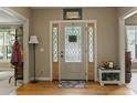 Welcoming foyer with hardwood floors, a decorative front door with sidelights, and neutral wall colors at 2139 Bramlett Nw Pl, Marietta, GA 30064