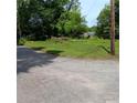 Street view of vacant lot offering development opportunities in a well-established and treed community at 2637 Johnson St, Lithonia, GA 30058