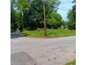 Street view of vacant lot presenting a blank canvas for your new home or development in a growing area at 2637 Johnson St, Lithonia, GA 30058