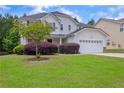 Well-maintained two-story home with lush green lawn, attractive landscaping, and a two-car garage at 2951 Edgewater St, South Fulton, GA 30331