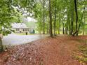 Spacious backyard with mature trees and ample space for outdoor activities at 3205 Brandywine Nw Pl, Marietta, GA 30064