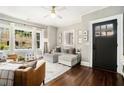 Cozy living room with hardwood floors, ample natural light, and a comfortable seating arrangement for relaxation at 614 Cooledge Ne Ave, Atlanta, GA 30306