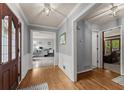 Welcoming foyer with hardwood floors and entrances to the living areas at 1172 Malvern Hunt Ct, Lawrenceville, GA 30043