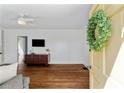 Bright living room featuring hardwood floors and a decorative wreath on the front door at 131 Lively St, Norcross, GA 30071