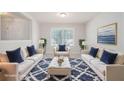 Bright living room showcasing neutral walls, plush sofas, a decorative rug, and natural light at 45 Waterloo Ct, Hiram, GA 30141