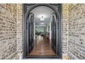 Grand foyer featuring hardwood floors and an ornate, arched doorway at 1136 Garner Creek At Parkview Sw Dr, Lilburn, GA 30047