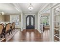 Elegant foyer showcasing hardwood floors, double doors, and dining room view at 1136 Garner Creek At Parkview Sw Dr, Lilburn, GA 30047