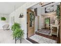 Welcoming front foyer with charming decor, tile flooring, and an open view into the home at 400 N Peachtree Pkwy, Peachtree City, GA 30269