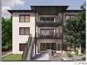 Multi-level balconies highlight the rear exterior of this modern home with stairs leading to the landscaped yard at 4109 Abbotts Bridge Rd, Duluth, GA 30097