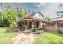 Inviting front porch with stone path, rocking chairs, and craftsman-style details at 814 Clarke Trl, Dacula, GA 30019