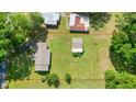A high-angle aerial shot of the home and boundary in a neighborhood filled with trees at 110 Barnesdale Ter, Woodstock, GA 30188