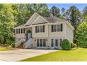 View of the traditional two-story home with vinyl siding and well-maintained front lawn at 3835 Annandale Ln, Suwanee, GA 30024
