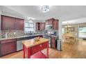 Charming kitchen with stainless steel appliances, custom backsplash, and center island at 2505 Oakrill Rd, Marietta, GA 30062