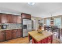 Spacious kitchen with stainless steel refrigerator, custom cabinets and eat in dining area at 2505 Oakrill Rd, Marietta, GA 30062