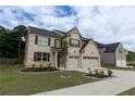 Beautiful two-story home with a two-car garage, set in a landscaped yard at 133 Canal St, Hampton, GA 30228