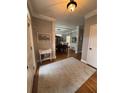 Spacious entry way showcases hardwood floors and charming decor leading to the dining room at 1502 La Fayette Pl, Loganville, GA 30052