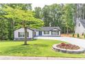 Well manicured lawn and landscaping around a modern farmhouse at 2265 Hillbriar Dr, Buford, GA 30518