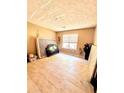 Spacious bedroom with neutral tile flooring and a window at 107 Honeysuckle Ln, Stockbridge, GA 30281