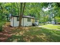 Lovely single-story home with a freshly painted exterior, new stairs, and mature trees at 1678 Capistrana Pl, Decatur, GA 30032