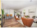 Open-concept living area featuring modern decor, hardwood floors, and plenty of natural light at 1678 Capistrana Pl, Decatur, GA 30032