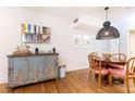 Vintage cabinet and dining area with modern pendant light at 35 Sheridan Ne Dr # 7, Atlanta, GA 30305
