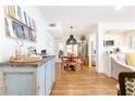 Bright dining area with vintage cabinet and modern decor, leading to updated kitchen at 35 Sheridan Ne Dr # 7, Atlanta, GA 30305