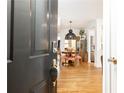 Inviting entryway showcases hardwood floors and a dining area with statement lighting at 35 Sheridan Ne Dr # 7, Atlanta, GA 30305