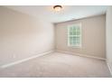 Neutral bedroom with window and neutral carpet at 300 Oregan Trl, Marietta, GA 30080