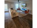 Bright living room with a large sofa, stylish decor, a ceiling fan and an electric fireplace at 4839 Station Lane -Lot 31, Union City, GA 30349