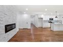 Bright open concept living space featuring hardwood floors, and a stone fireplace at 1321 Avon Sw Ave, Atlanta, GA 30310