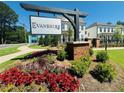 Evanshire community sign with colorful landscaping and well-maintained lawn at 2260 Siskin Square Rd # 90, Duluth, GA 30096