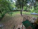 Expansive backyard featuring lush greenery and mature trees, offering a private outdoor retreat at 2985 Laguna Dr, Decatur, GA 30032