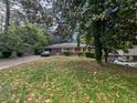 Charming one-story home with a classic brick facade and a well-maintained front yard at 2985 Laguna Dr, Decatur, GA 30032