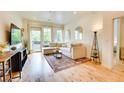 Inviting living space features hardwood floors, cozy seating, and a view to the doorway at 1430 Dresden Ne Dr # 225, Atlanta, GA 30319