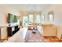 Bright living room with large windows, cozy sectional sofa, and stylish decor at 1430 Dresden Ne Dr # 225, Atlanta, GA 30319