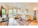 Cozy living area features a comfortable sectional sofa and a sliding door to the outside at 1430 Dresden Ne Dr # 225, Atlanta, GA 30319