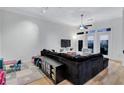 Cozy living room with a spacious sectional, modern lighting, and access to an outdoor balcony at 400 17Th Nw St # 1119, Atlanta, GA 30363