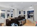 Open-concept living area flowing into the kitchen, featuring a comfortable sectional and stylish decor at 400 17Th Nw St # 1119, Atlanta, GA 30363