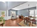Bright and airy living room showcasing hardwood floors, high ceilings, and natural light at 813 Poplar Ter, Canton, GA 30115